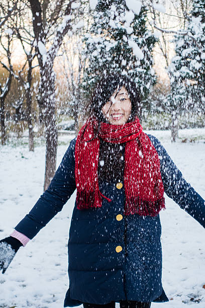 istock Happy woman throwing snow 498498204