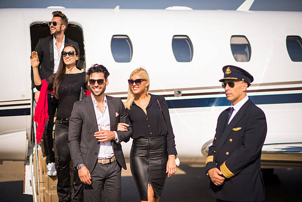 istock Group of people leaving private jet airplane 498501322