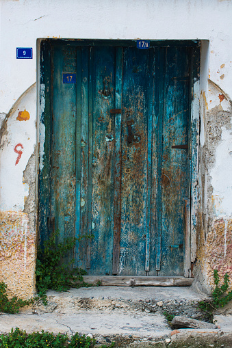 Blue door with decorative door nails in Chefchaouen, Morocco, Africa.