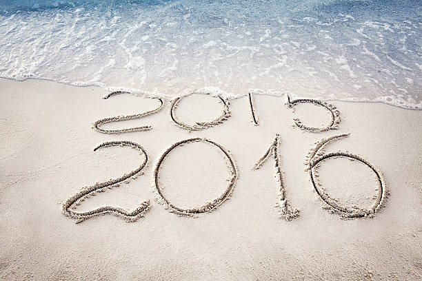istock New Year 2016 replace 2015 concept on the sea beach 498503902