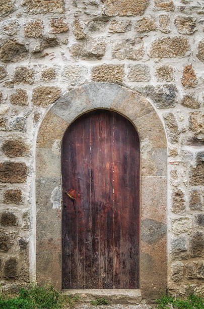 istock Old monastery  brown wooden door 498504046