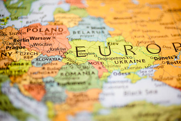 Nations:  Map of Eastern European countries. Warsaw, Poland. Map featuring Eastern European countries with focus on Poland, Germany, Czech Republic. Other countries include: Ukraine and Slovakia. Cities include: Warsaw, Kiev, Berlin, Prague. Many other countries are also defocused in image.  eastern europe stock pictures, royalty-free photos & images