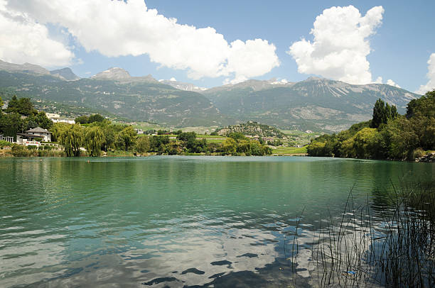 Lake Gironde Lac de Géronde is a lake in the commune of Sierre in Valais. waist deep in water stock pictures, royalty-free photos & images