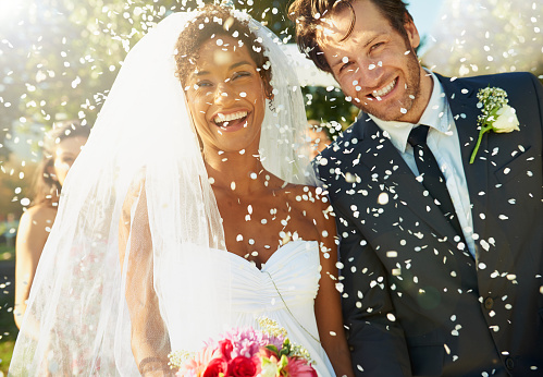 Shot of a happy newlywed couple being showered with confettihttp://195.154.178.81/DATA/i_collage/pu/shoots/784347.jpg