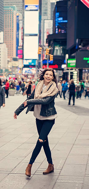 istock Cute girl dancing by herself in Time Square, New York. 498505160