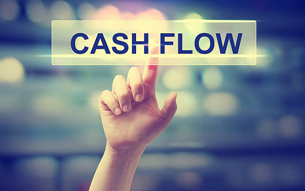 Cash Flow concept with hand pressing a button stock photo
