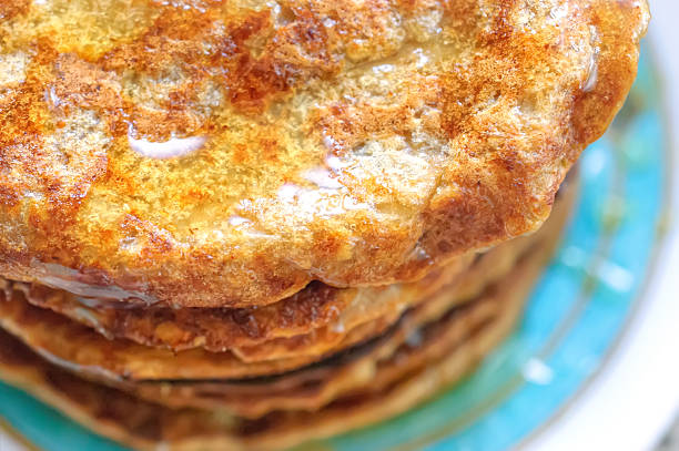 istock Stack of wheat  pancakes with honey on plate, close-up 498505312