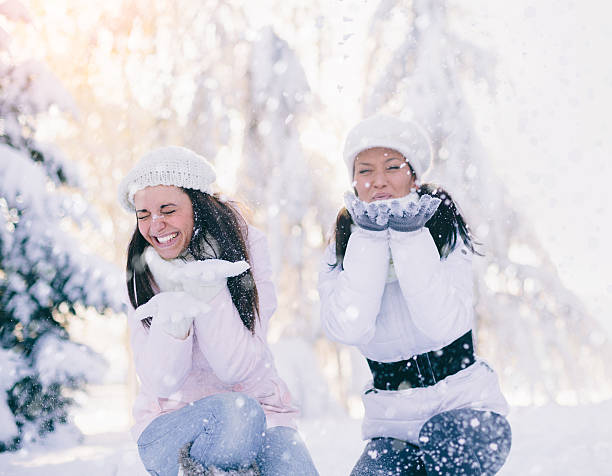 istock Two girls having fun outdoors in the winter 498505332