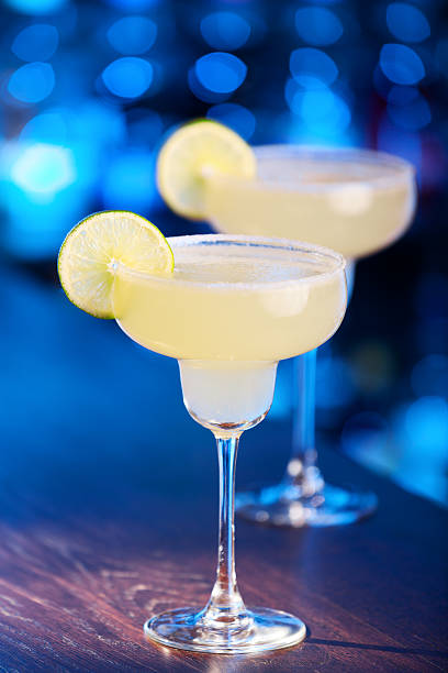 istock Two Margarita cocktails on a bar 498506088