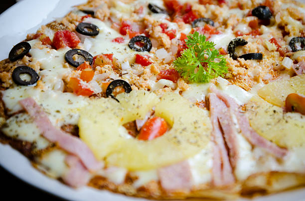 istock Homemade Pizza,half salmon and half Hawaiian. 498507495