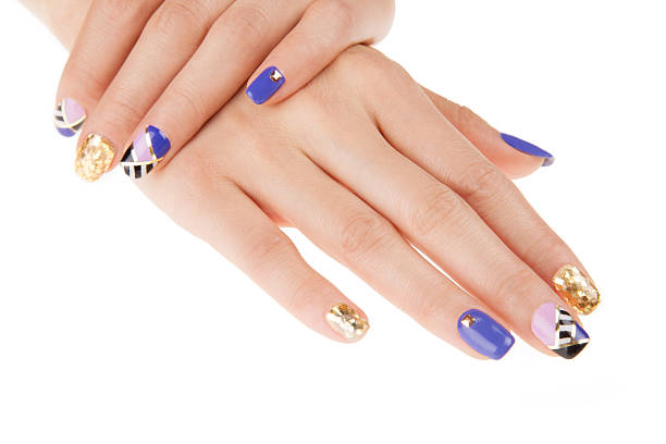 istock Nail art with gold colors and studs. Stylish geometric pattern. 498507567