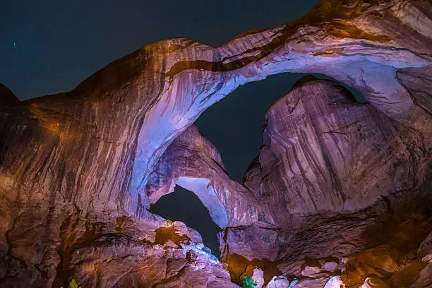 Long Exposure light painting with stars Double arch moab utah Arches National Park