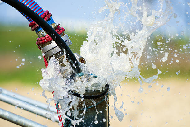 cleaning newly constructed water bore or well with air compressor - putten stockfoto's en -beelden