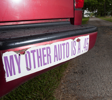 Old bumper sticker owned by a person who has guns