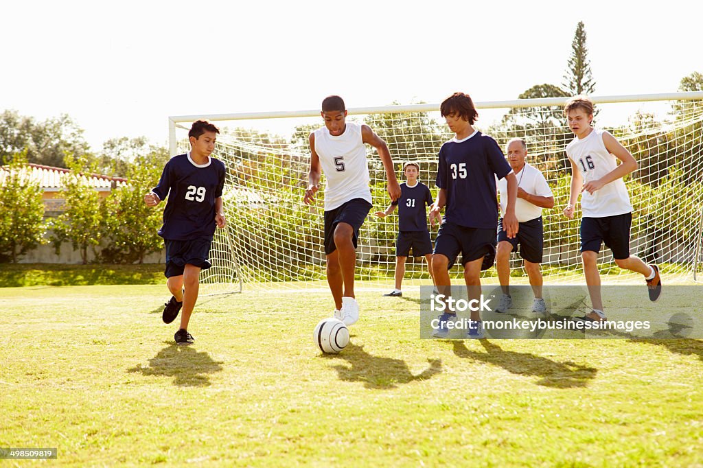 Members Of Male High School Soccer Playing Match Soccer Stock Photo