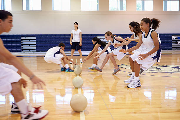 istock High School Students Playing Dodge Ball In Gym 498510097