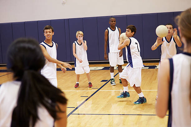 istock High School Students Playing Dodge Ball In Gym 498510173