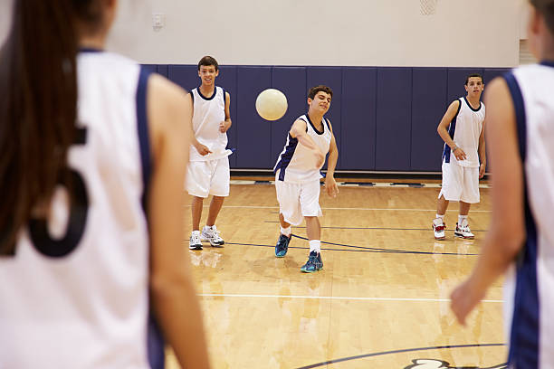 istock High School Students Playing Dodge Ball In Gym 498510353