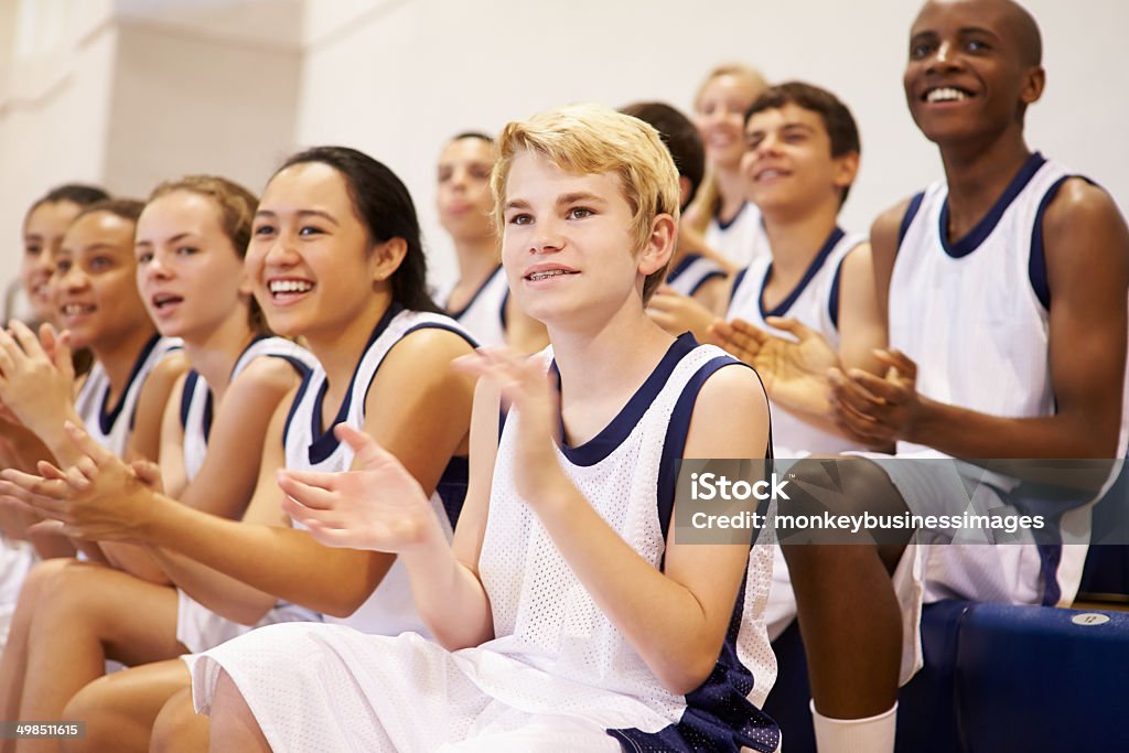 Spectators Watching High School Basketball Team Match Spectators Watching High School Basketball Team Match Applauding Cheering Stock Photo
