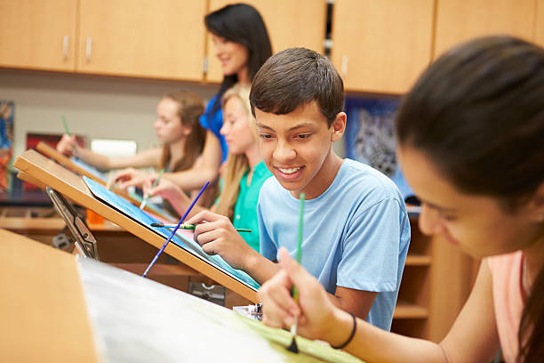 istock Male Pupil In High School Art Class 498511987