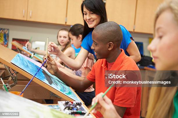 Male Pupil In High School Art Class With Teacher Stock Photo - Download Image Now - Art, Painted Image, Teenager