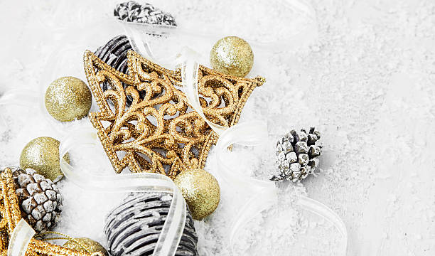 istock Golden Shiny Christmas Decorations in the Snow with Elegant Ribb 498523480