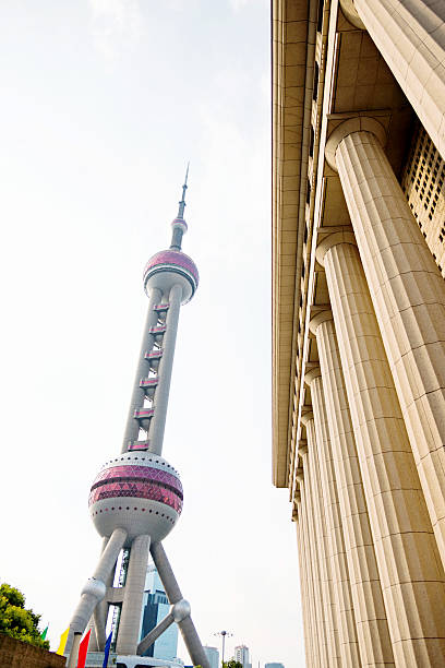 istock Roman columns and Shanghai oriental pearl tower 498524294