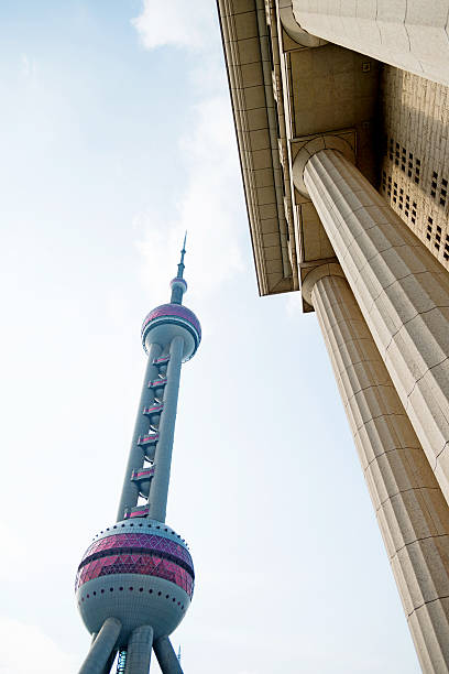 istock Roman columns and Shanghai oriental pearl tower 498524576