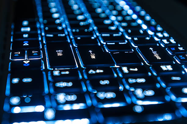 новые войны технологии - back lit computer keyboard keypad blue стоковые фото и изображения