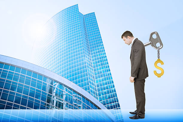 istock Businessman with key in back and cityscape 498525124