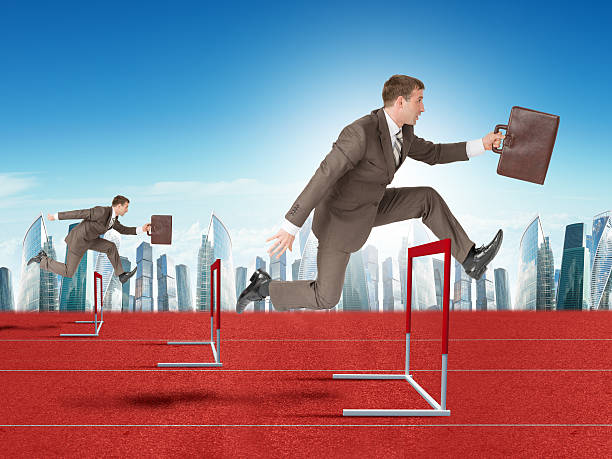 istock Men hopping over treadmill barrier with city 498525240