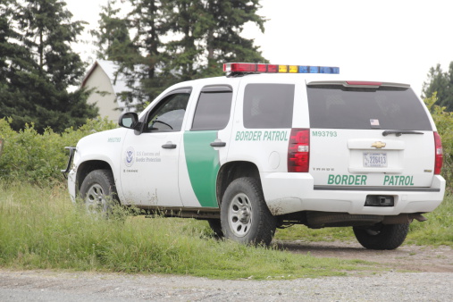 Sumas, Washington, USA - June 17, 2014: An American border patrol vehicle is parked beside the Canada and US border keeping watch.