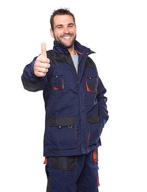 istock Portrait of smiling worker in blue uniform 498528243