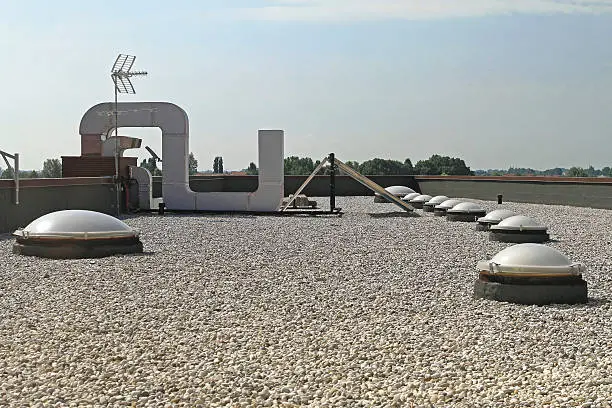 Flat Roof With Gravel and Skylight Windoows