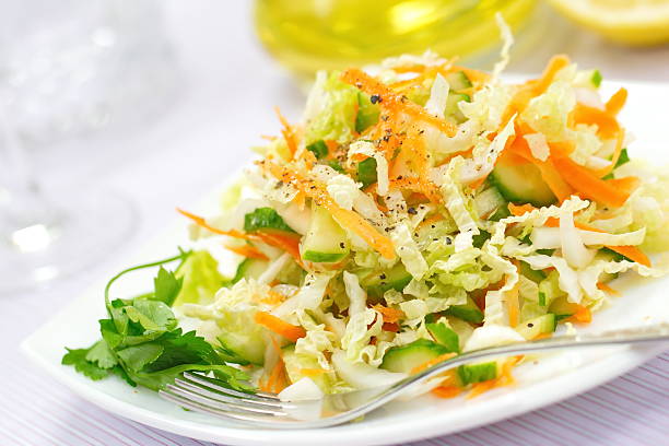 istock Salad made of fresh cucumbers, cabbage and carrots 498529134