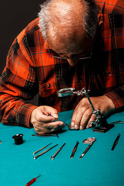 istock Repairing old pocket watch 498529359