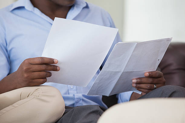 istock Couple calculating bills on the couch 498529625