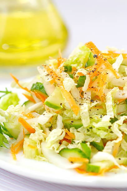 istock Salad made of fresh cucumbers, cabbage and carrots 498529638