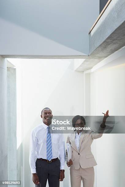 Estate Agent Showing Buyer Around Stock Photo - Download Image Now - 20-29 Years, Adult, African Ethnicity