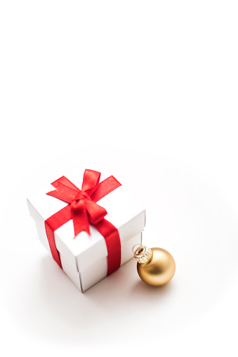 Gift box with golden christmas bauble , horizontal