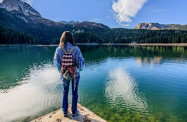 istock Young woman admires beautiful panorama 498529884