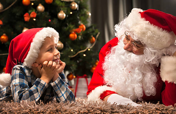 istock Santa Claus and a little boy 498530630