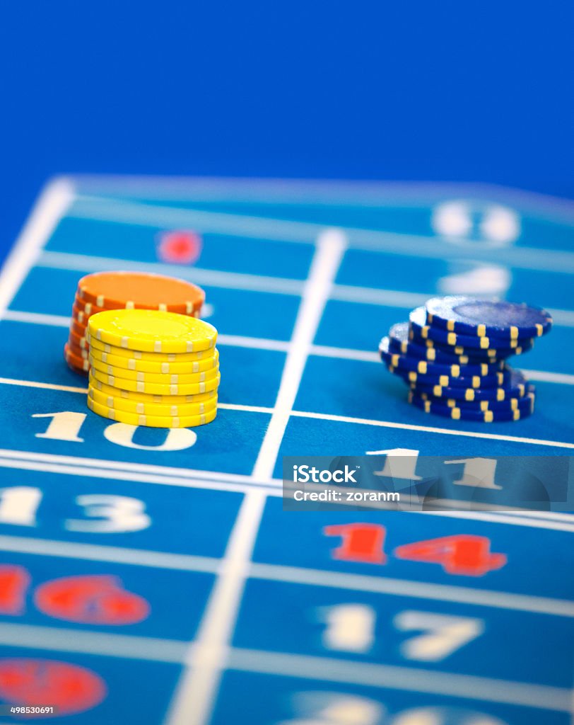 Gambling chips Gambling chips positiones on felt, copy space Addiction Stock Photo