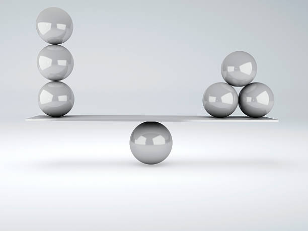 istock white spheres in equilibrium. Balance concept 498530715