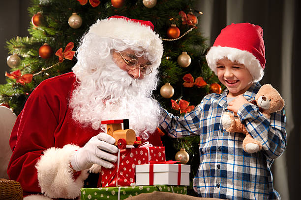 istock Santa Claus and a little boy 498530778
