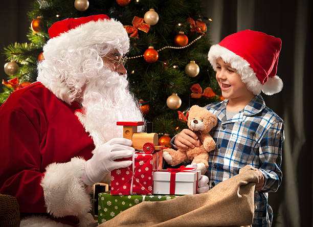 istock Santa Claus and a little boy 498530938