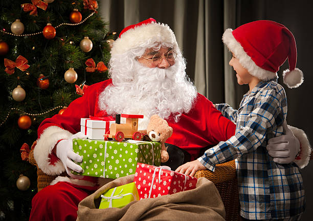 istock Santa Claus and a little boy 498531000