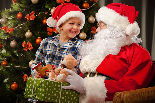 istock Santa Claus and a little boy 498531238
