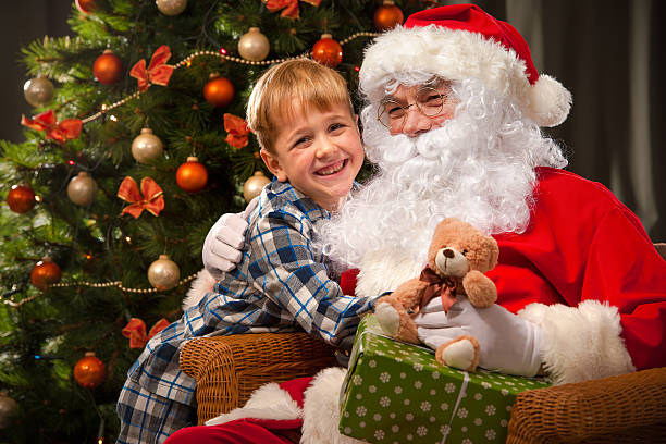 istock Santa Claus and a little boy 498531374
