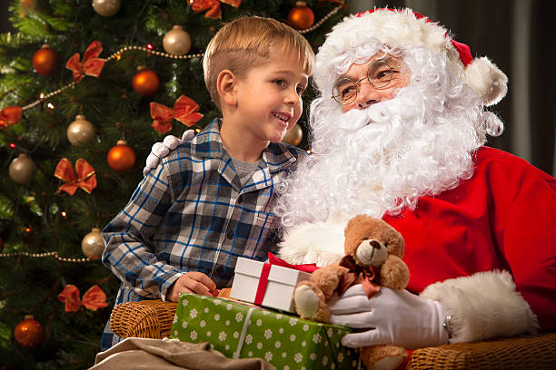 istock Santa Claus and a little boy 498531584